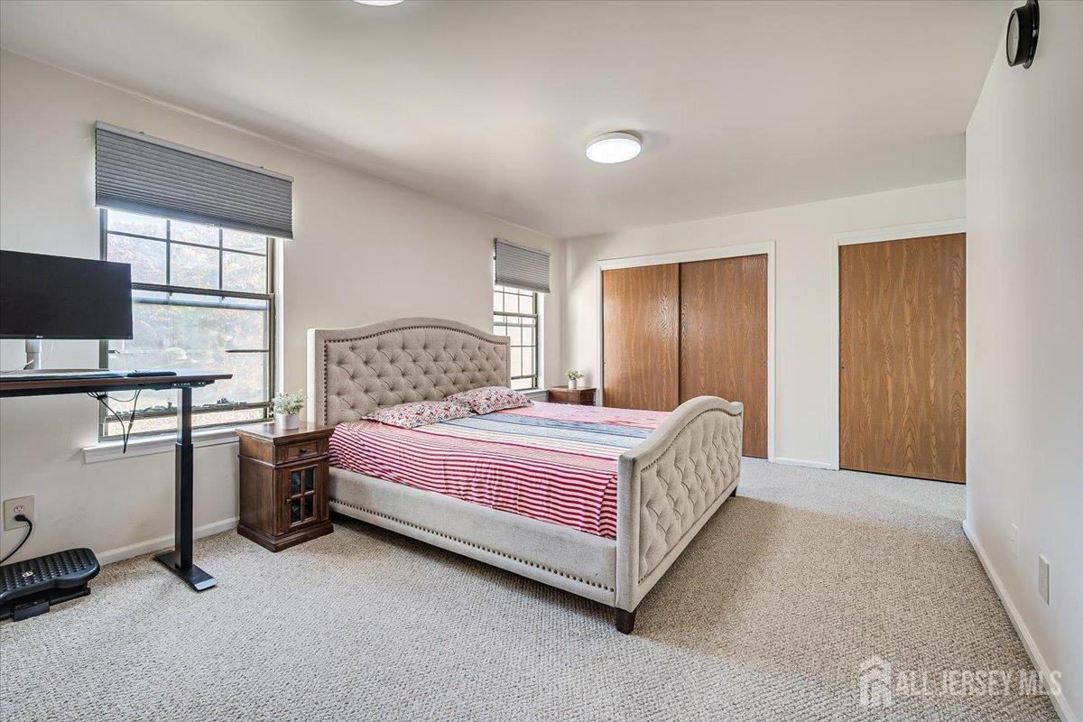 602 Maplecrest Road Edison, NJ 08820 - Photo 25 of 42 a bedroom with a bed and a window