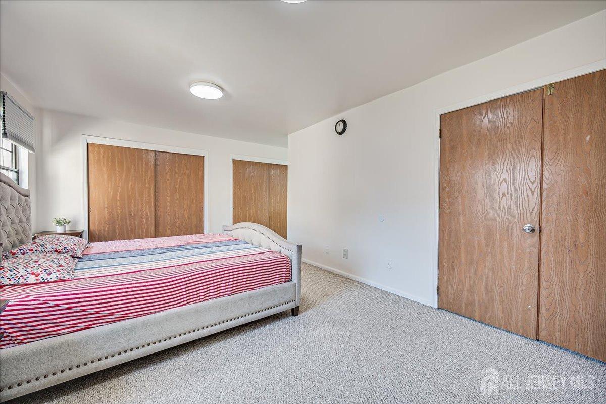 602 Maplecrest Road Edison, NJ 08820 - Photo 26 of 42 a bedroom with a bed and a closet