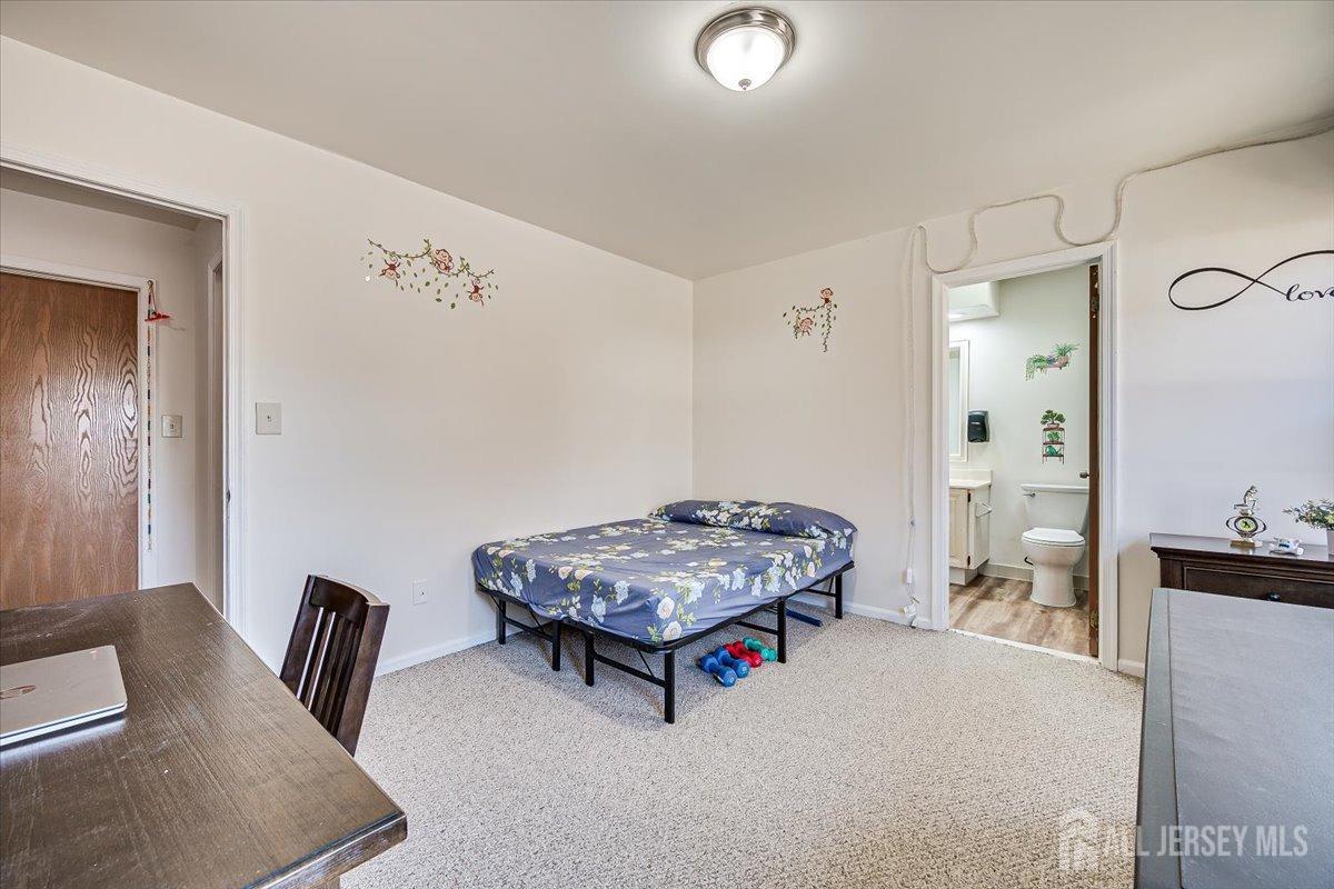 602 Maplecrest Road Edison, NJ 08820 - Photo 30 of 42 a living room with furniture and a table