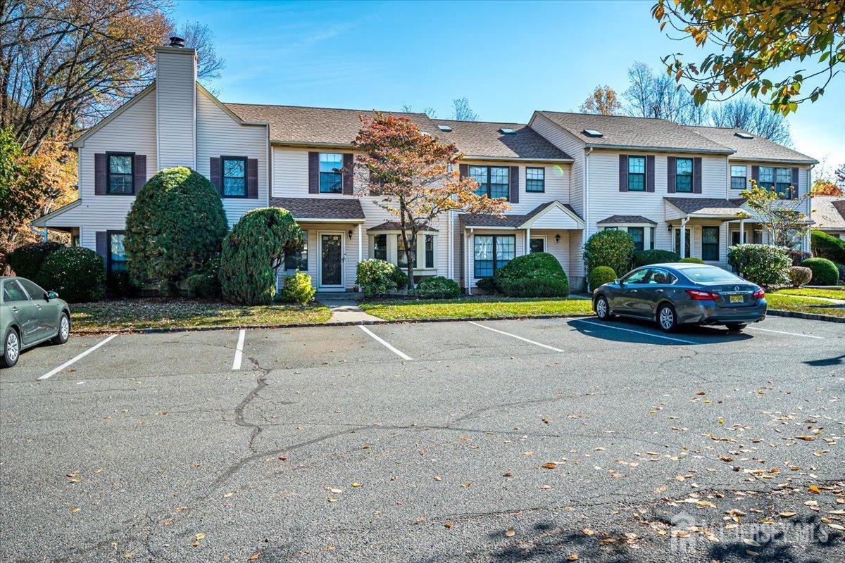 602 Maplecrest Road Edison, NJ 08820 - Photo 3 of 42 a front view of multiple houses with yard and green space