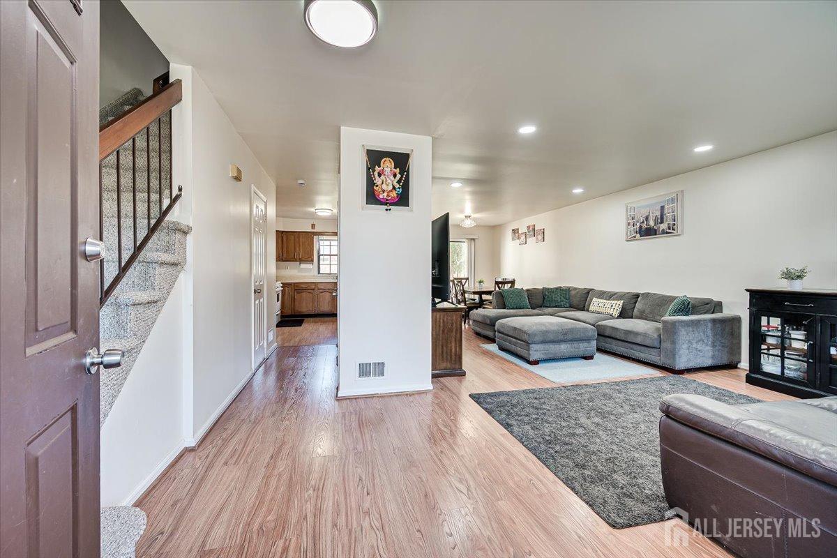 602 Maplecrest Road Edison, NJ 08820 - Photo 10 of 42 a living room with furniture and a wooden floor
