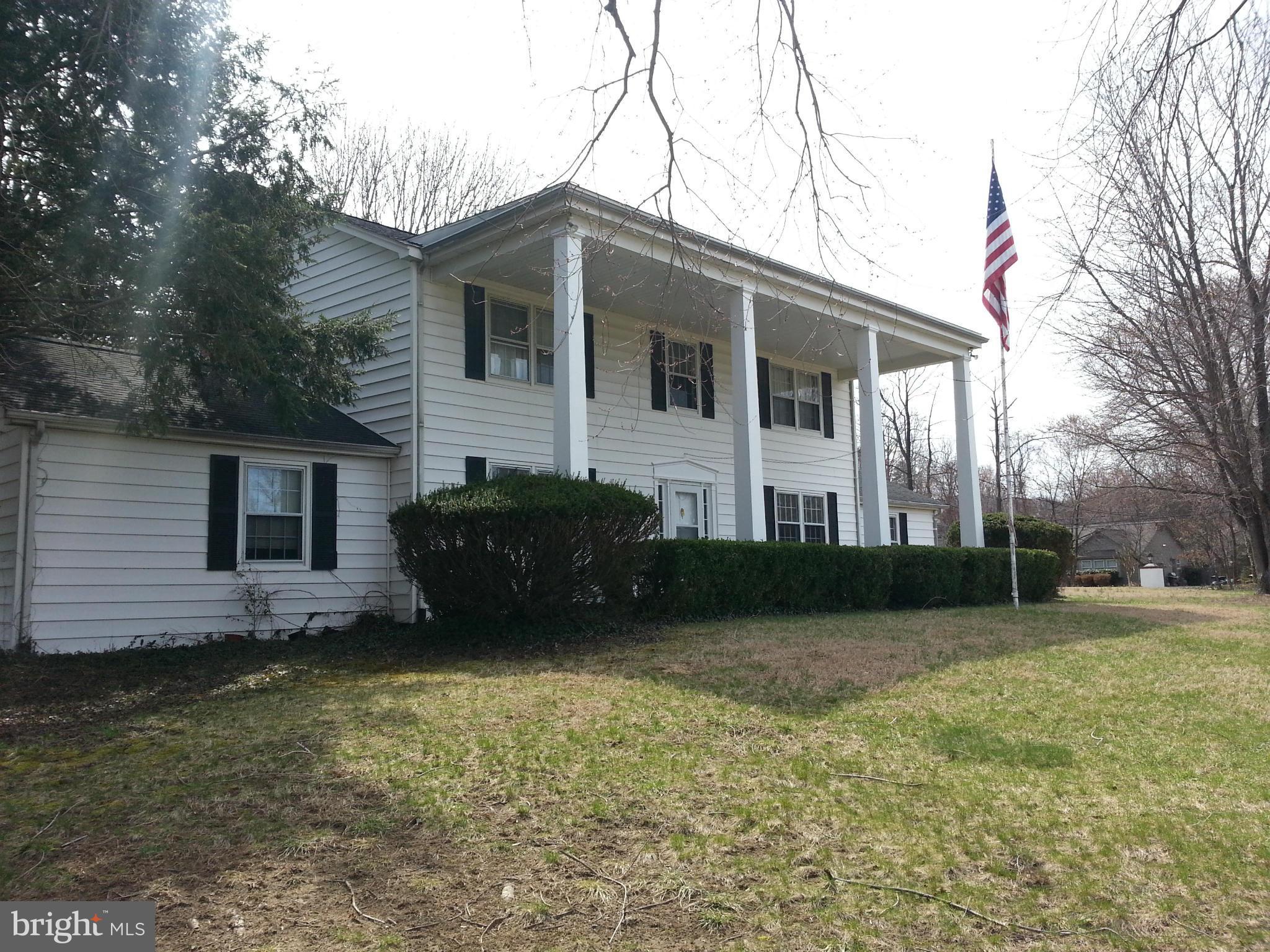 913 Melvin Road Annapolis, MD 21403 - Photo 2 of 22 Two story front porch with brick patio