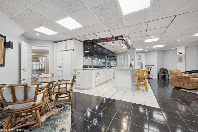 a view of a dining hall with many windows