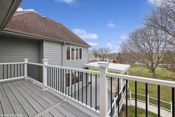 a view of a wooden deck and a yard