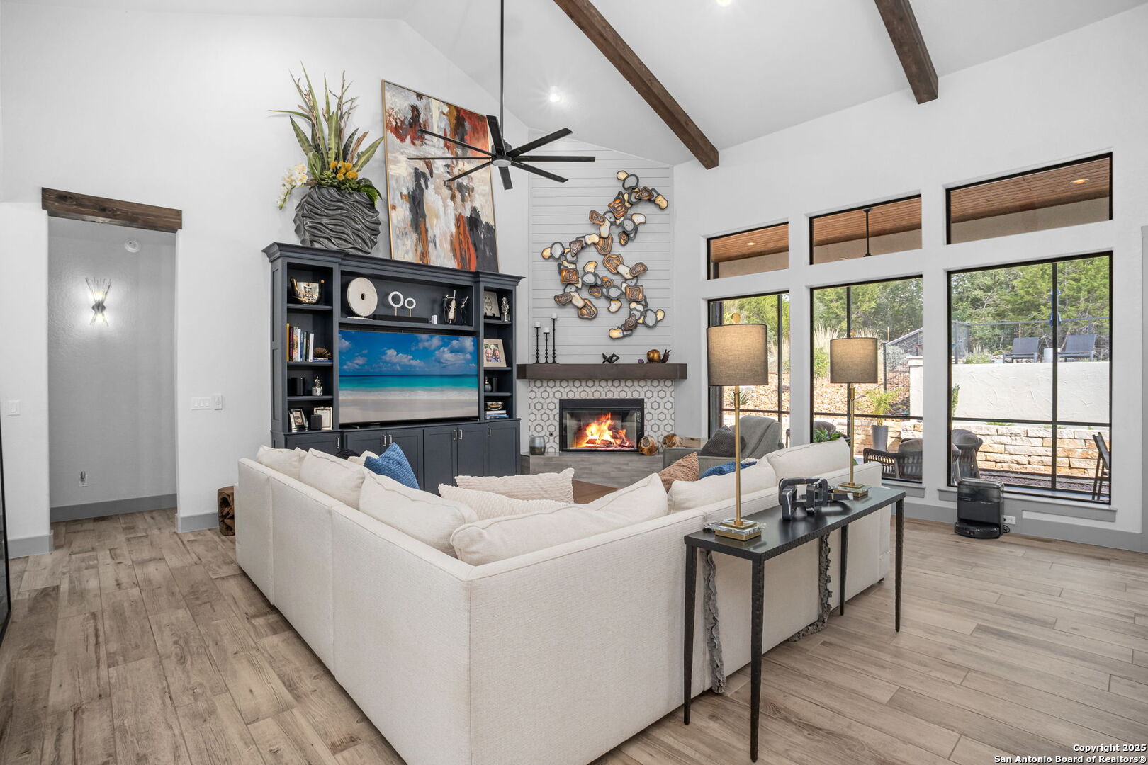 2016 Brunello New Braunfels, TX 78132 - Photo 12 of 53 a living room with furniture fireplace and flat screen tv