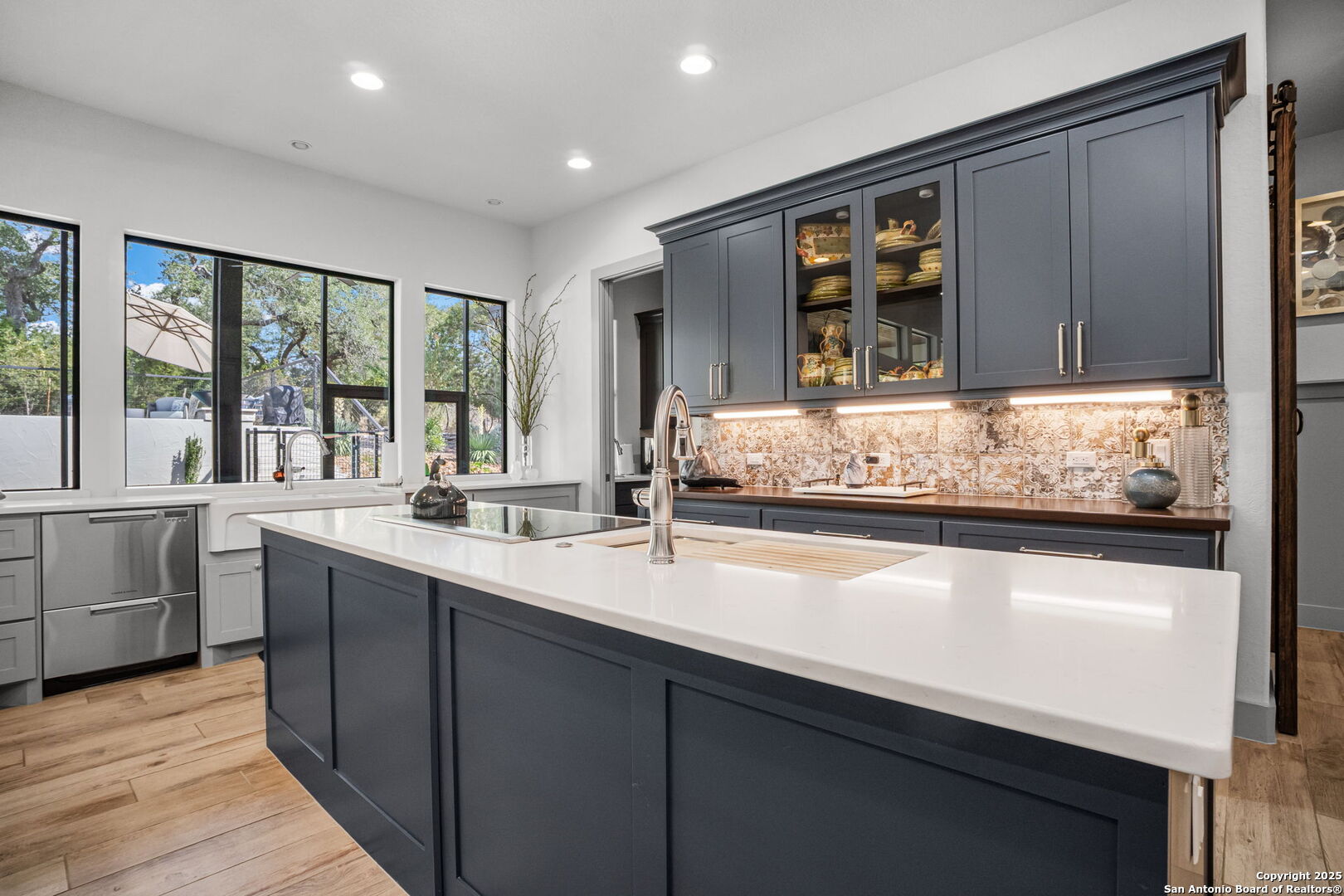 2016 Brunello New Braunfels, TX 78132 - Photo 17 of 53 a kitchen with sink a window and cabinets