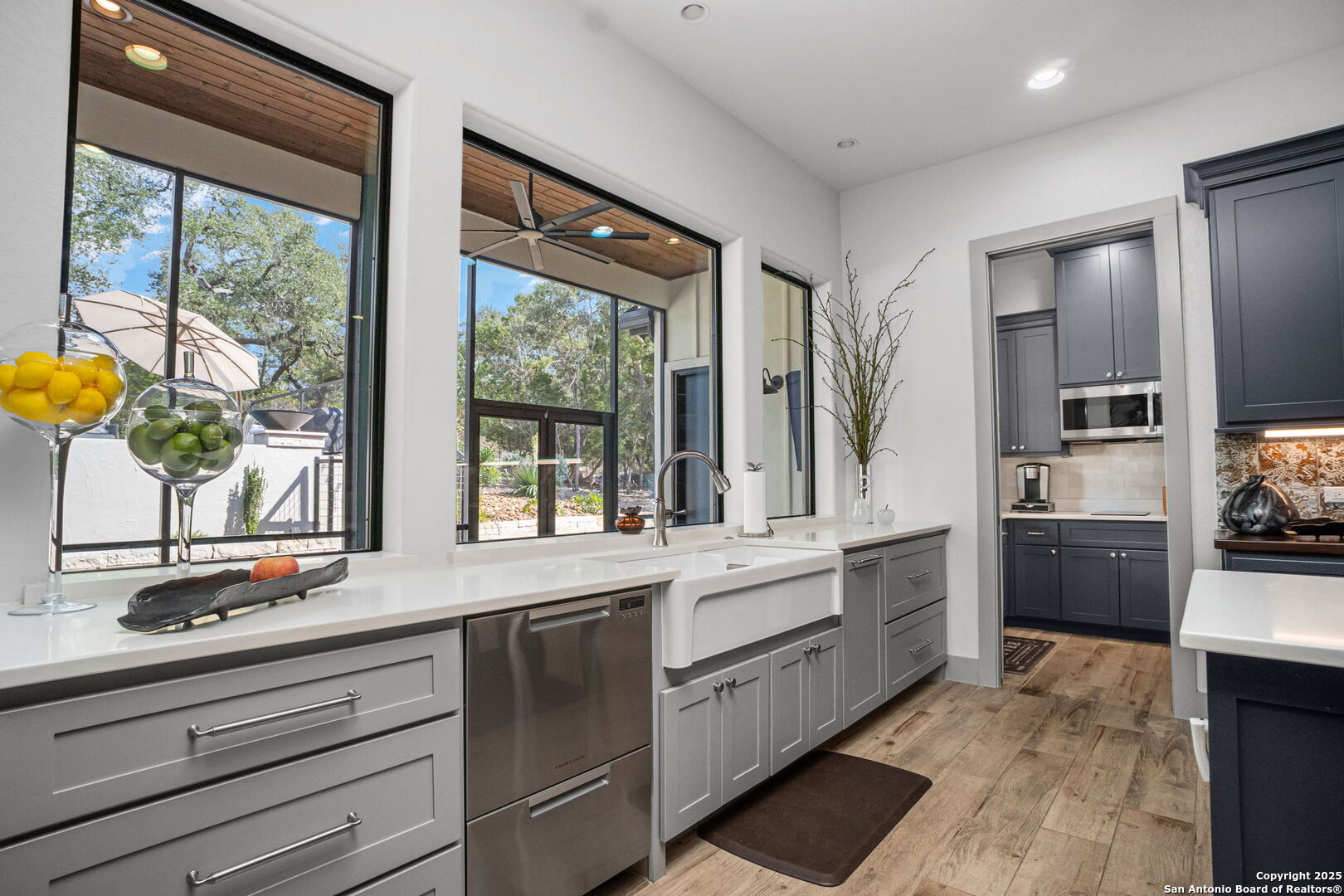 2016 Brunello New Braunfels, TX 78132 - Photo 19 of 53 a kitchen with stainless steel appliances kitchen island granite countertop a stove a sink and a refrigerator