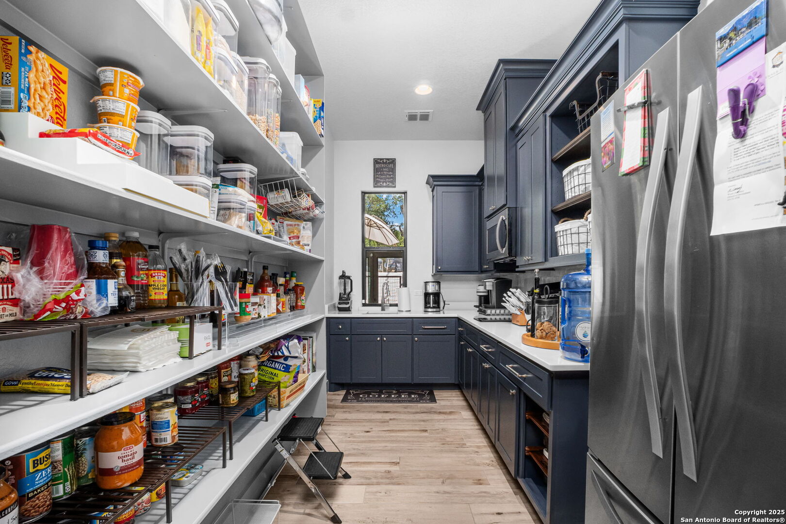 2016 Brunello New Braunfels, TX 78132 - Photo 21 of 53 a kitchen with lots of clutter and cabinets
