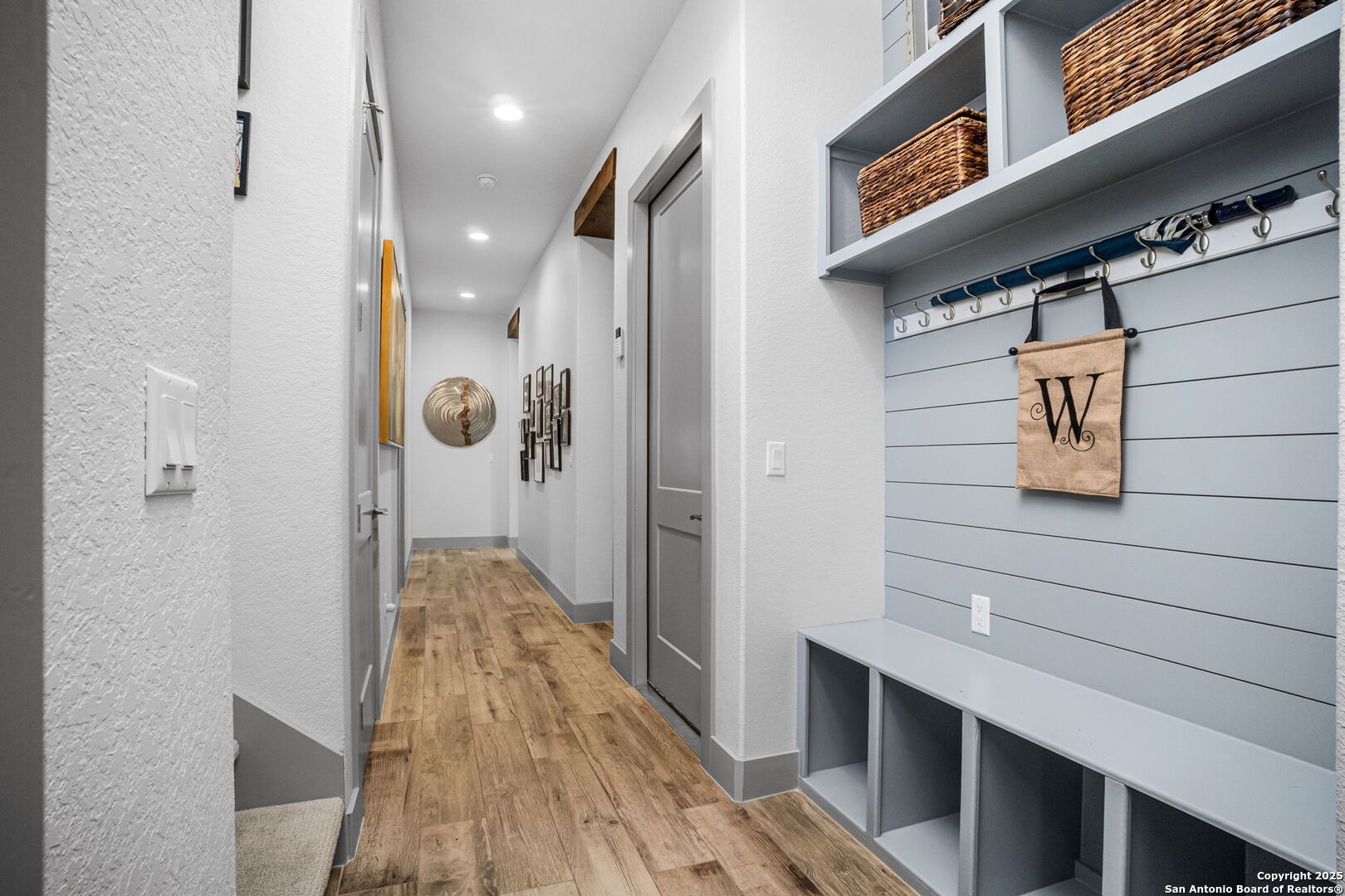 2016 Brunello New Braunfels, TX 78132 - Photo 22 of 53 a view of a hallway with wooden floor and staircase