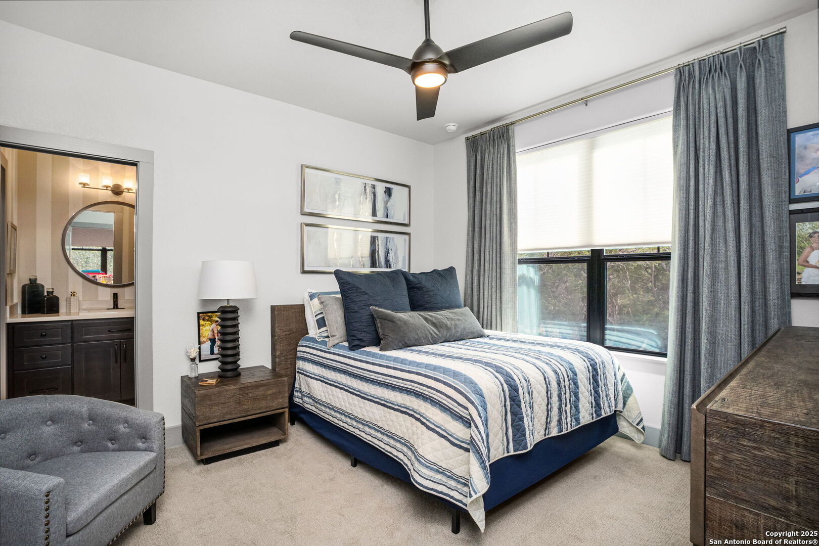 2016 Brunello New Braunfels, TX 78132 - Photo 33 of 53 a bedroom with a bed a dresser next to a window