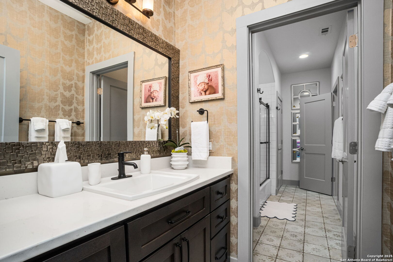 2016 Brunello New Braunfels, TX 78132 - Photo 34 of 53 a bathroom with a sink a mirror and a shower