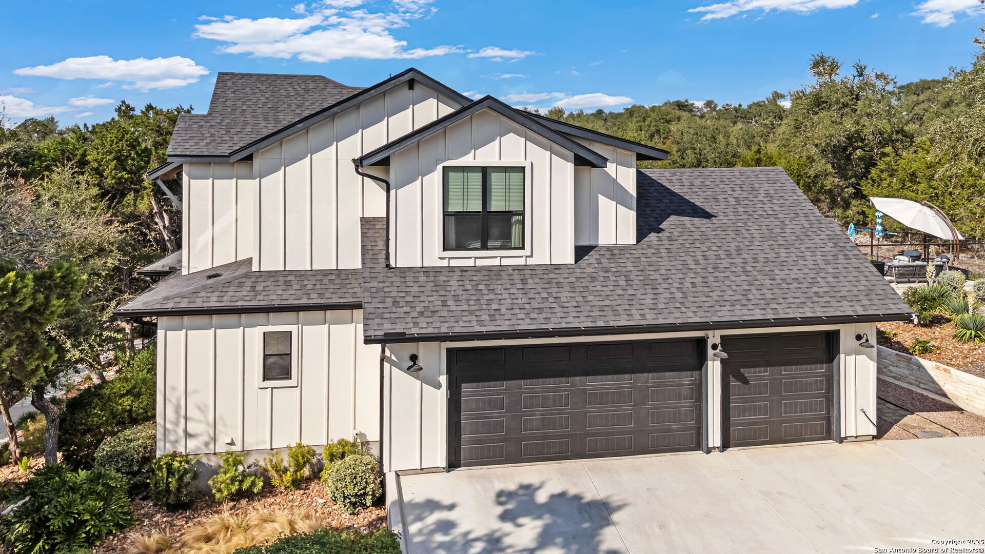2016 Brunello New Braunfels, TX 78132 - Photo 39 of 53 a front view of a house with a yard and garage