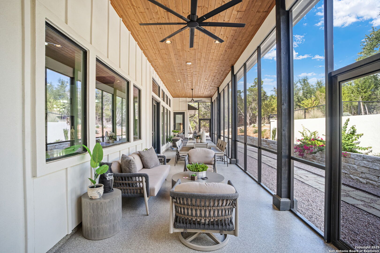 2016 Brunello New Braunfels, TX 78132 - Photo 41 of 53 a living room with furniture and a floor to ceiling window