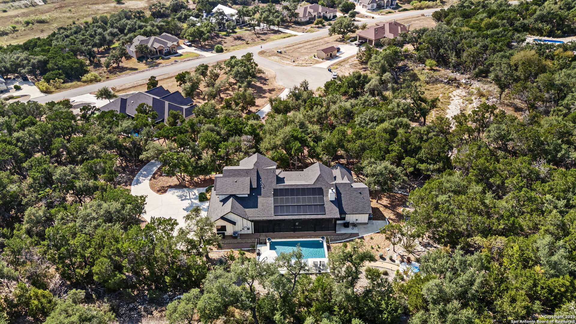2016 Brunello New Braunfels, TX 78132 - Photo 48 of 53 an aerial view of a house with a yard and large trees