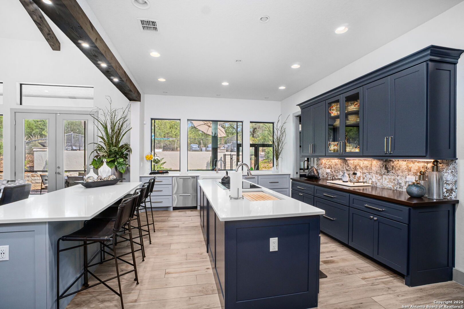 2016 Brunello New Braunfels, TX 78132 - Photo 5 of 53 a large kitchen with stainless steel appliances kitchen island granite countertop a large kitchen island a stove a sink a dining table and chairs