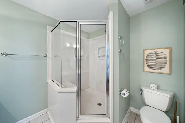 a bathroom with a shower and toilet