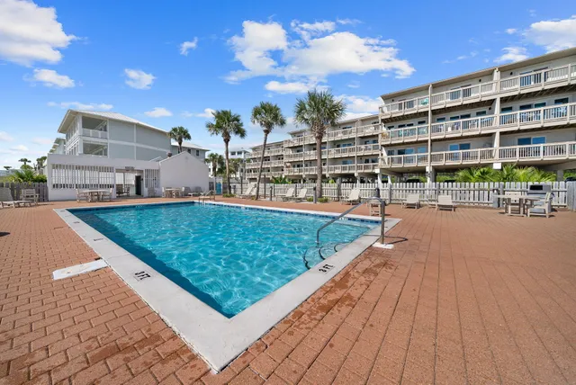 a view of a swimming pool with a lounge chairs