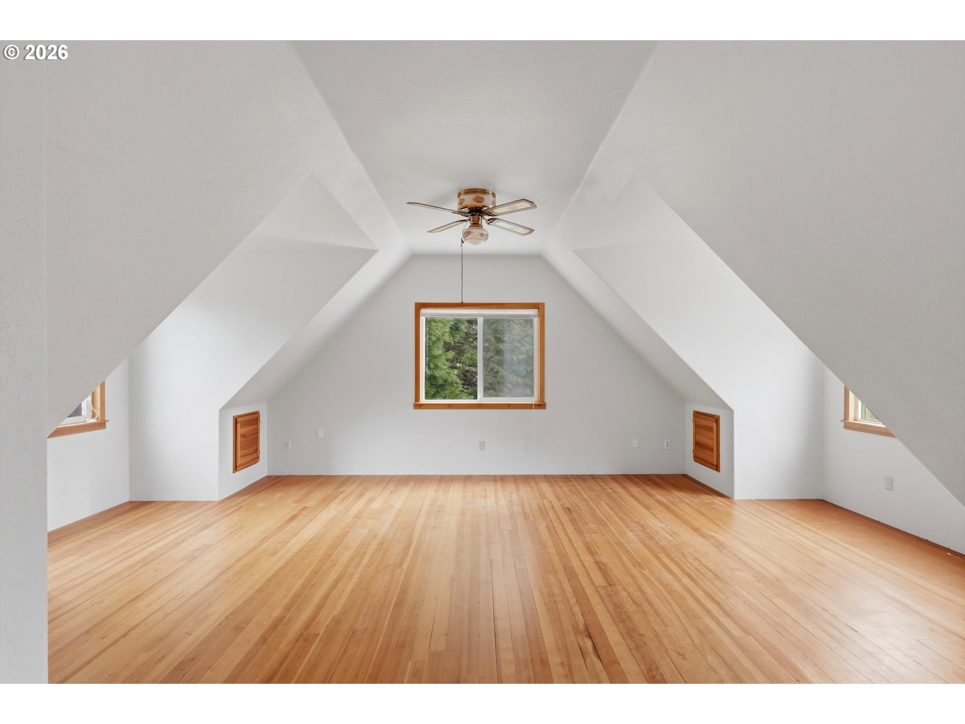 82320 Bay Road Seaside, OR 97138 - Photo 14 of 47 a view of an empty room with a window and wooden floor
