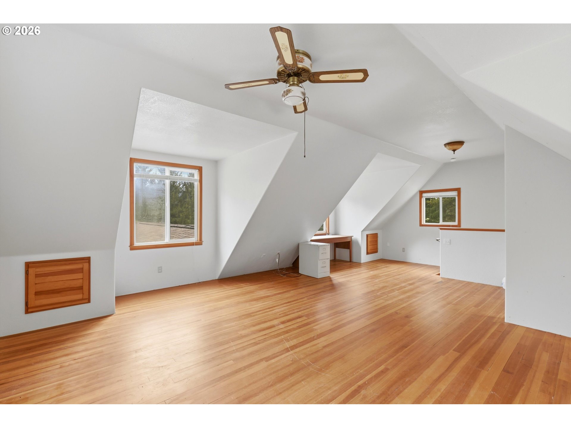 82320 Bay Road Seaside, OR 97138 - Photo 15 of 47 a view of an empty room with a window and wooden floor
