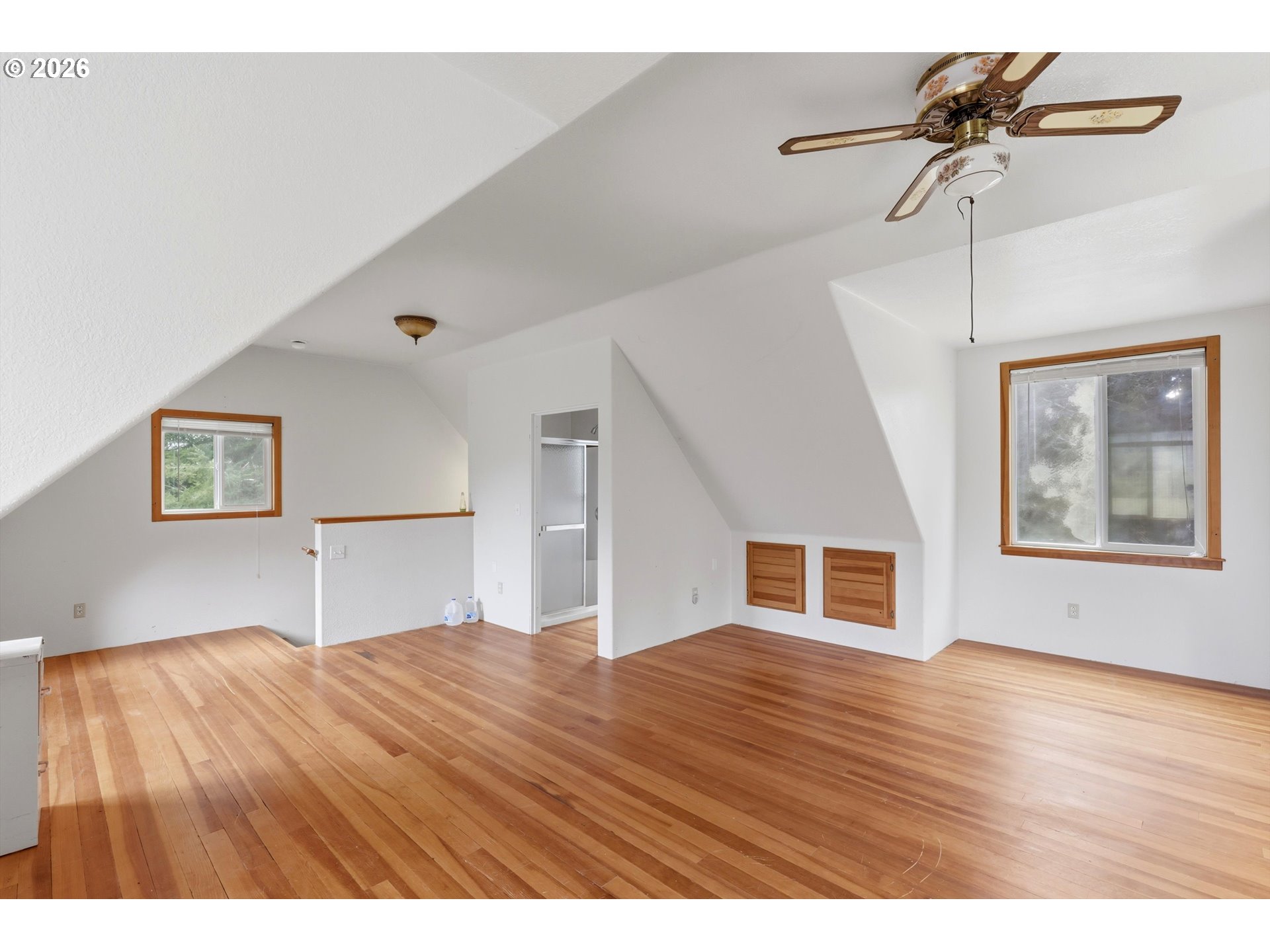 82320 Bay Road Seaside, OR 97138 - Photo 16 of 47 a view of an empty room with window and wooden floor