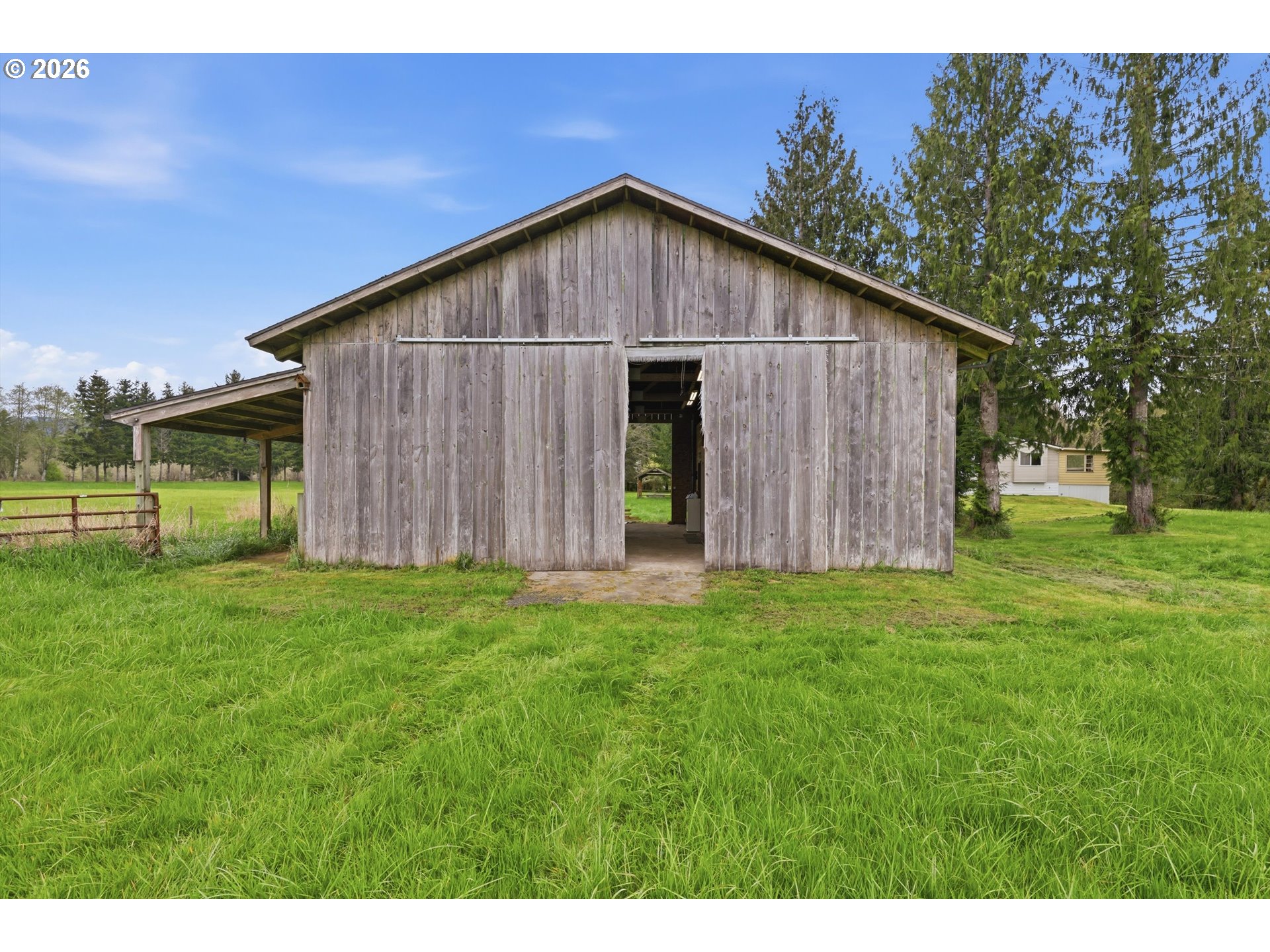 82320 Bay Road Seaside, OR 97138 - Photo 29 of 47 a wooden house with a yard