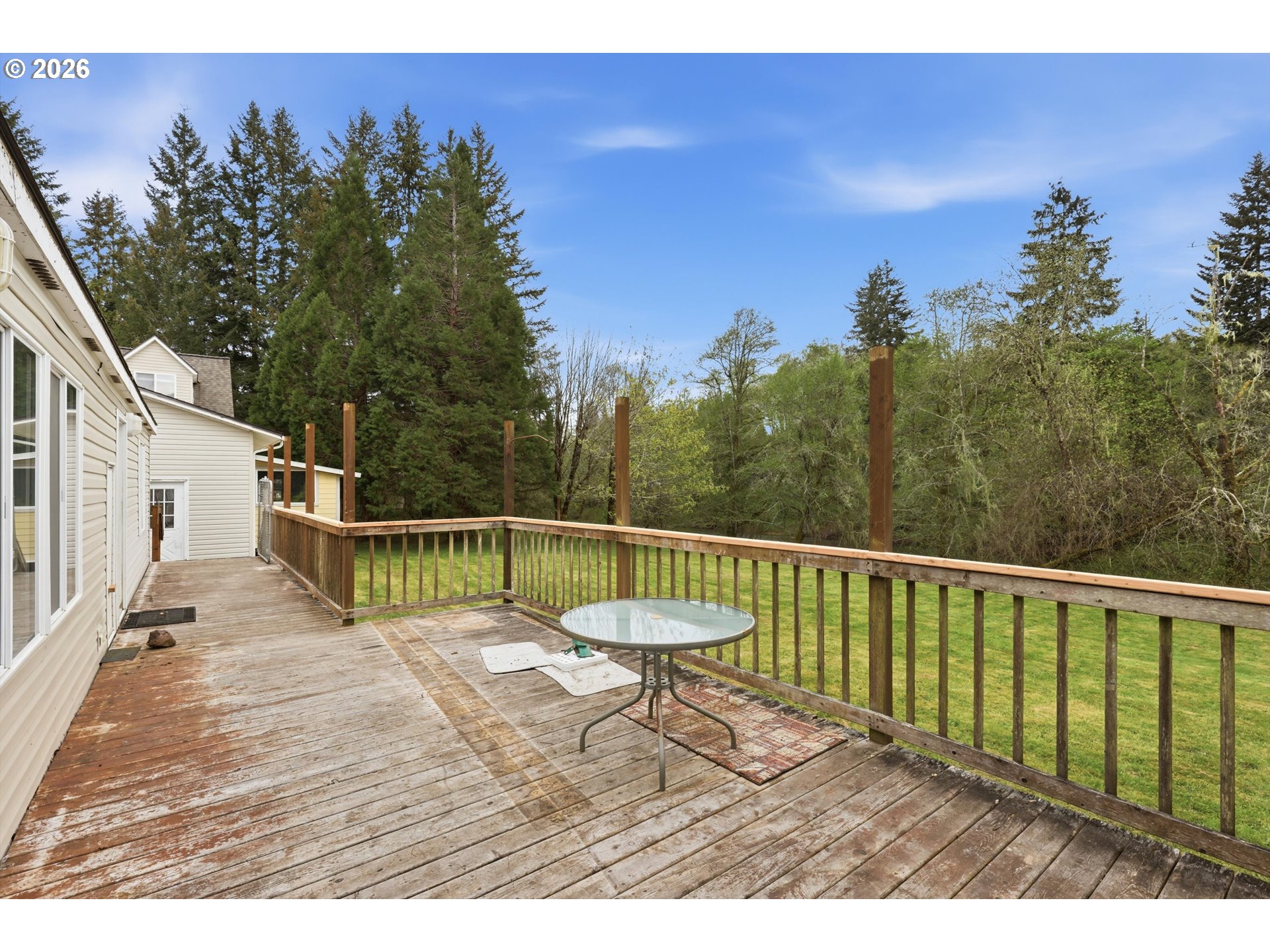 82320 Bay Road Seaside, OR 97138 - Photo 32 of 47 a view of a balcony with wooden floor and fence
