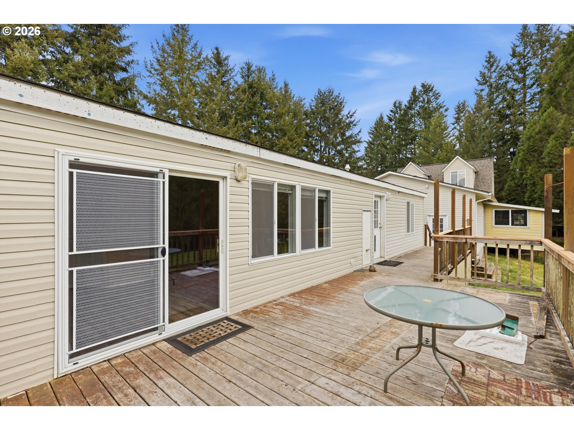 82320 Bay Road Seaside, OR 97138 - Photo 33 of 47 a balcony with table and chairs