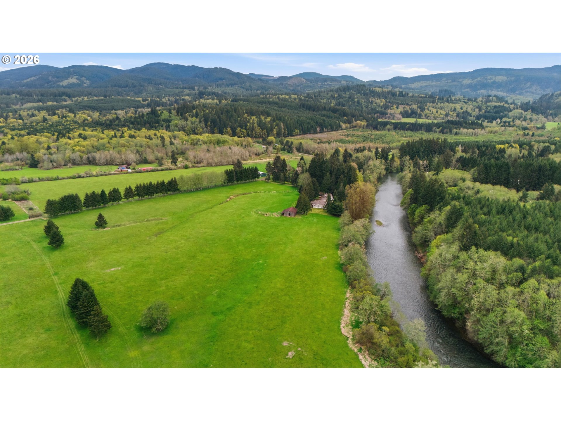 82320 Bay Road Seaside, OR 97138 - Photo 44 of 47 a open area with river and trees in the background