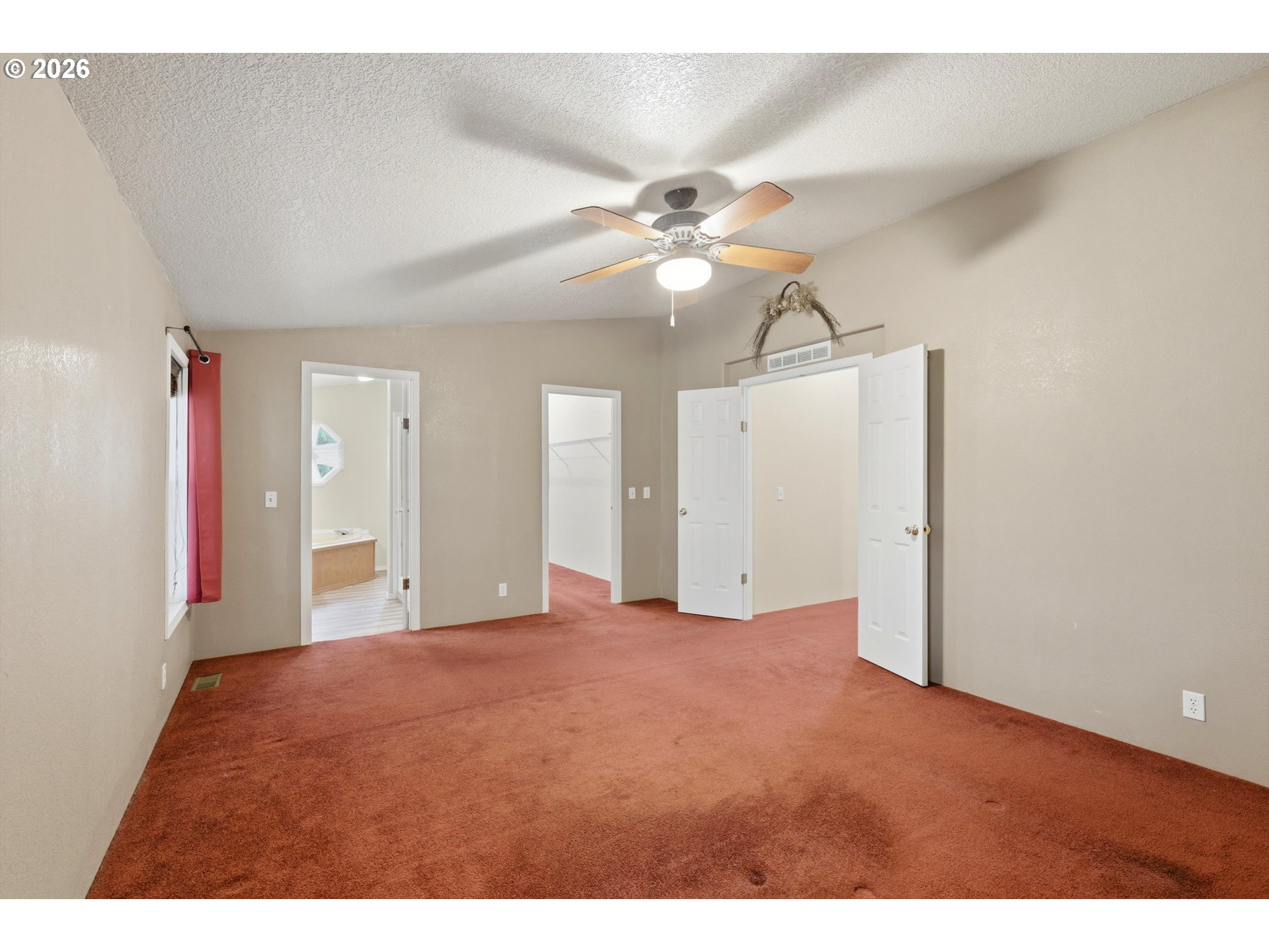 82320 Bay Road Seaside, OR 97138 - Photo 8 of 47 a view of a big room with chandelier fan and windows