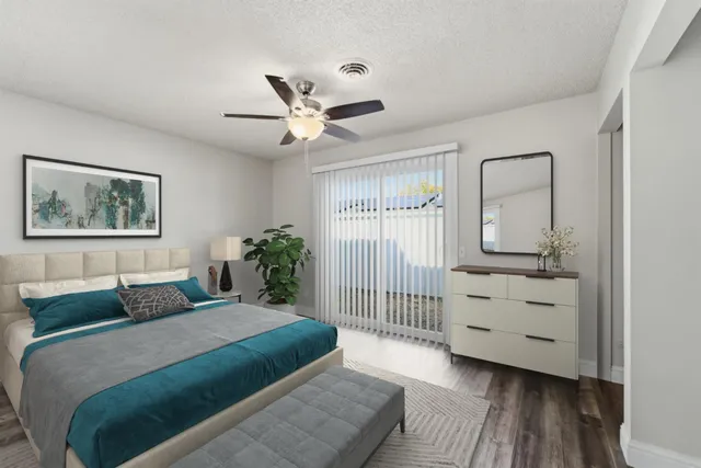 a bedroom with a bed and a window