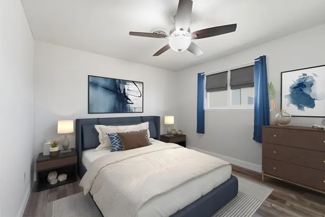 a bedroom with a bed and a dresser