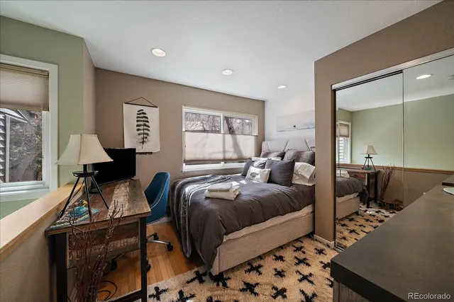 a bed room with a bed and a desk