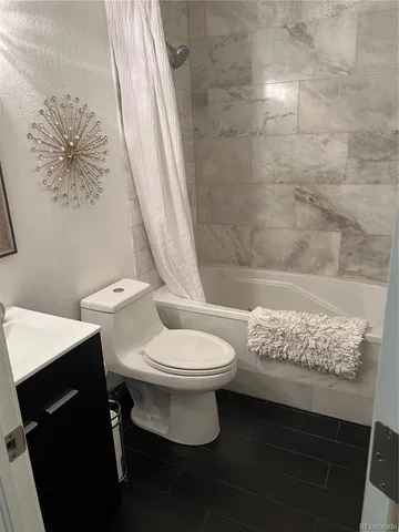 a view of hallway with wooden floor and furniture