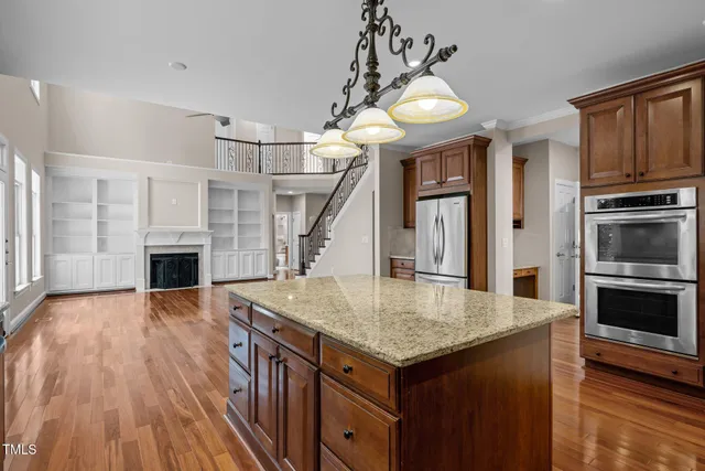 a room with pool table and windows