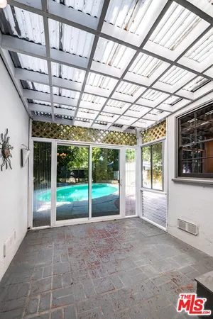 a view of porch with a ceiling fan