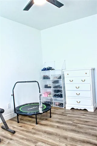 a bedroom with a bed and a mirror