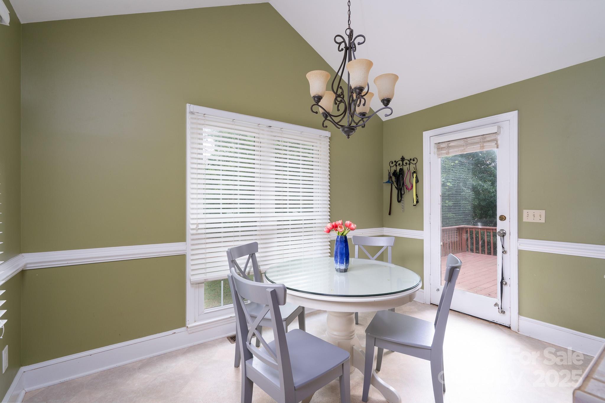 5820 Wingate Way Northwest Concord, NC 28027 - Photo 5 of 14 a view of a dining room with a table and chairs