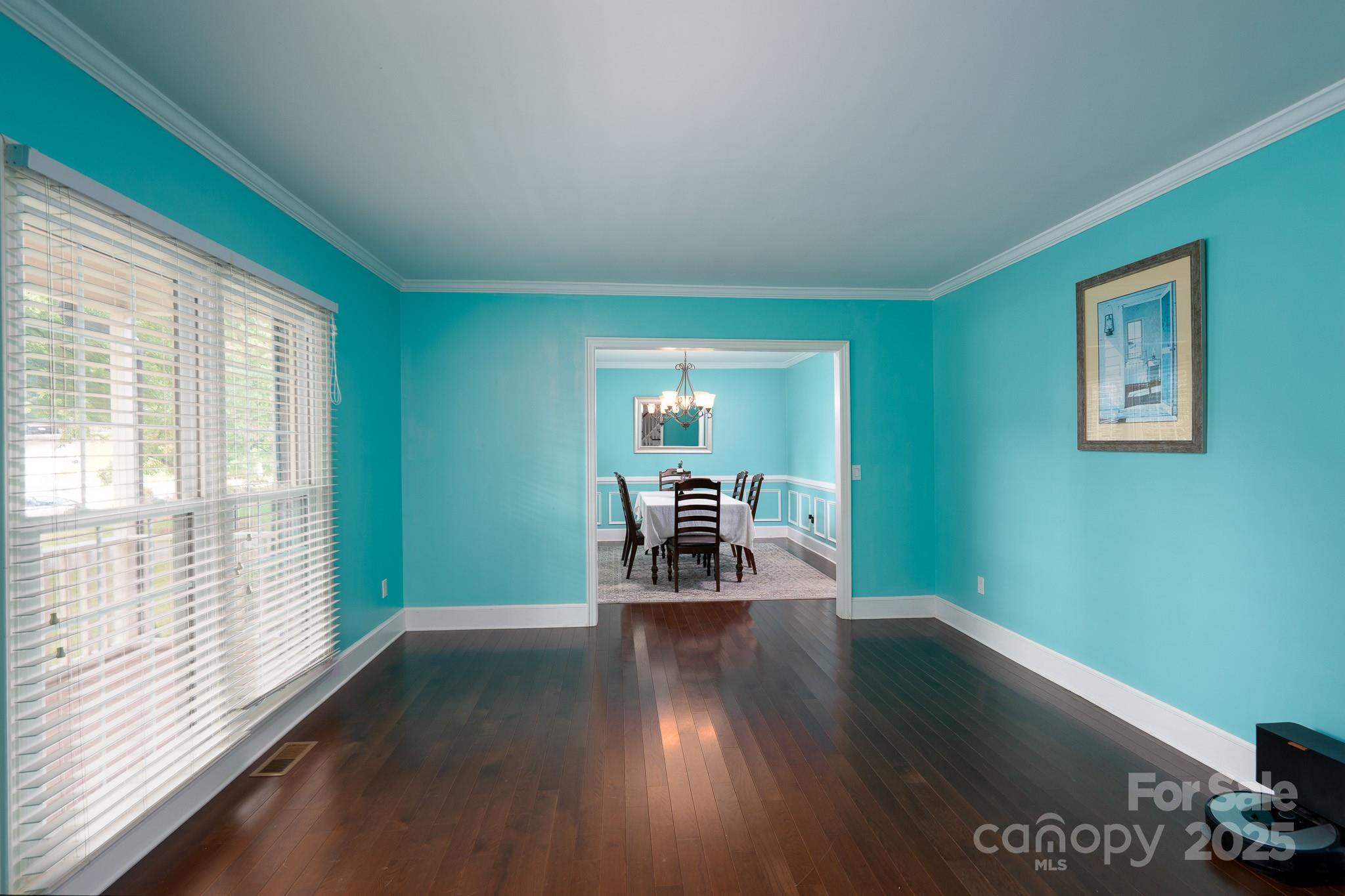 5820 Wingate Way Northwest Concord, NC 28027 - Photo 6 of 14 a dining room with furniture and wooden floor