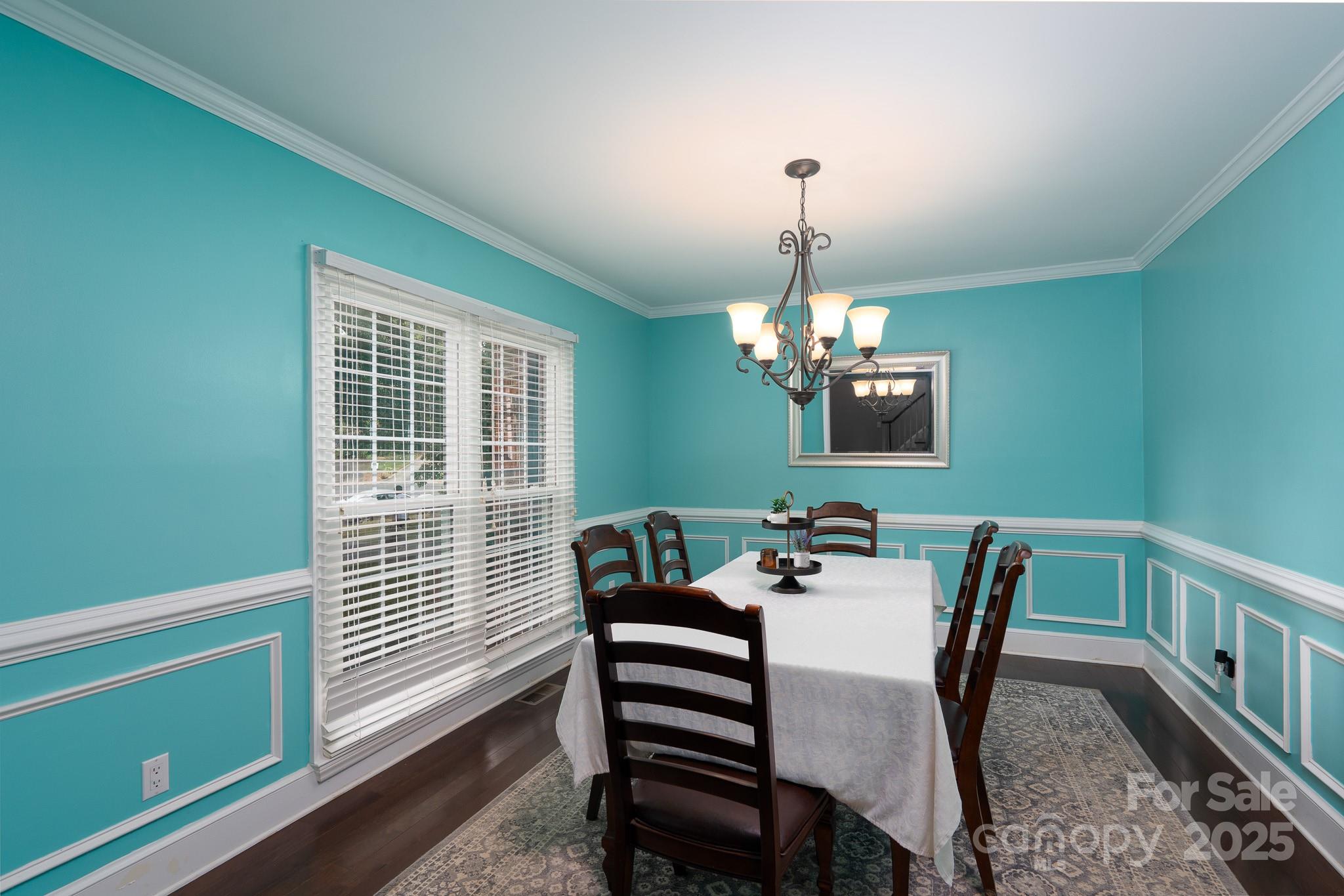 5820 Wingate Way Northwest Concord, NC 28027 - Photo 7 of 14 a view of a dining room with furniture window and wooden floor