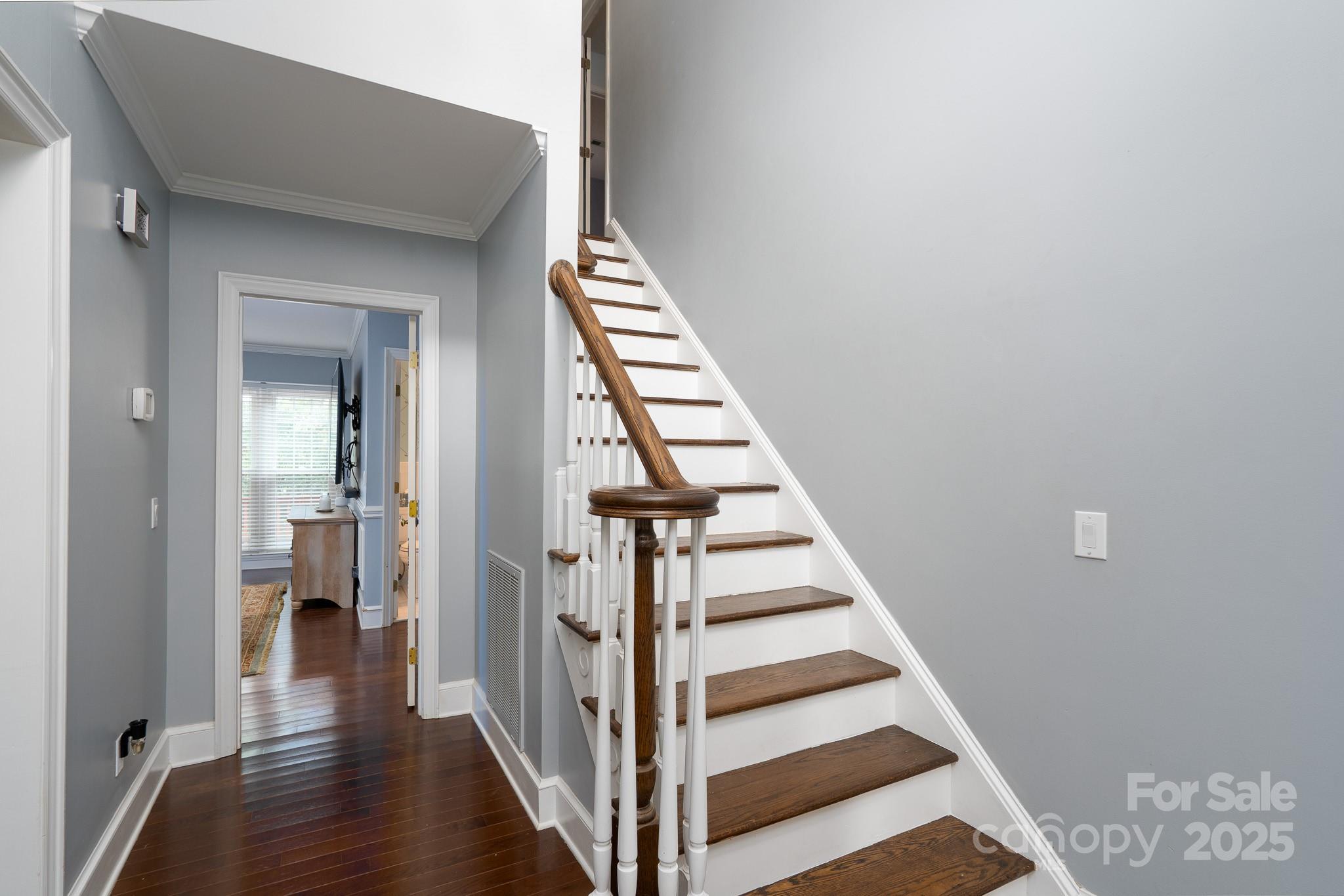5820 Wingate Way Northwest Concord, NC 28027 - Photo 8 of 14 a view of a hallway with wooden floor and entryway