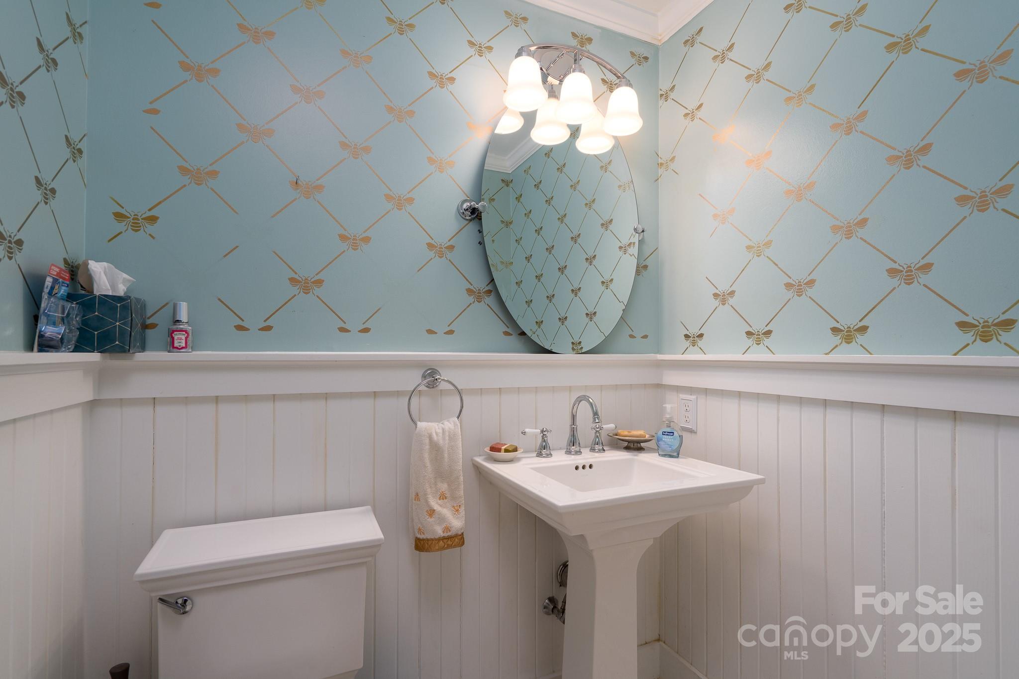 5820 Wingate Way Northwest Concord, NC 28027 - Photo 10 of 14 a bathroom with a sink a mirror and a toilet