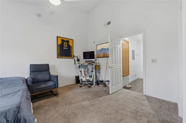 a bathroom with a shower sink and mirror