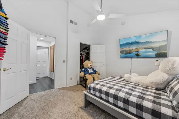 a bedroom with a bed and cabinets