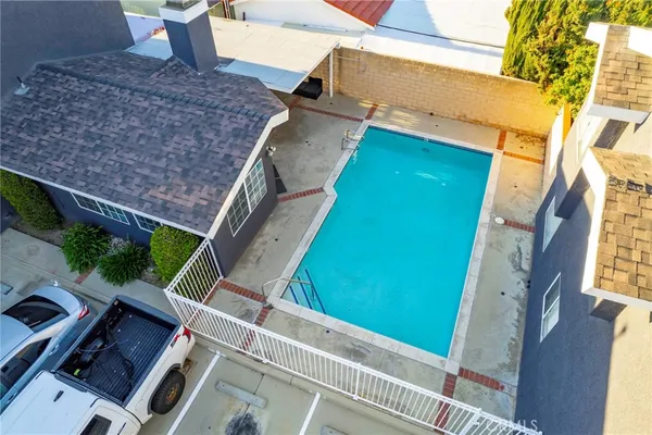 an aerial view of houses with outdoor space
