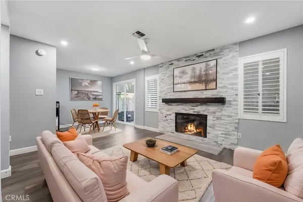 a living room with furniture and a fireplace