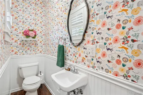 a bedroom with a bed and a night stand