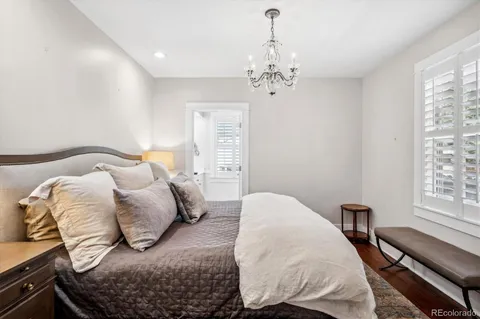 a bedroom with furniture and a rug