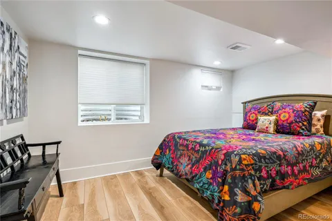 a view of a chair and table in backyard of the house