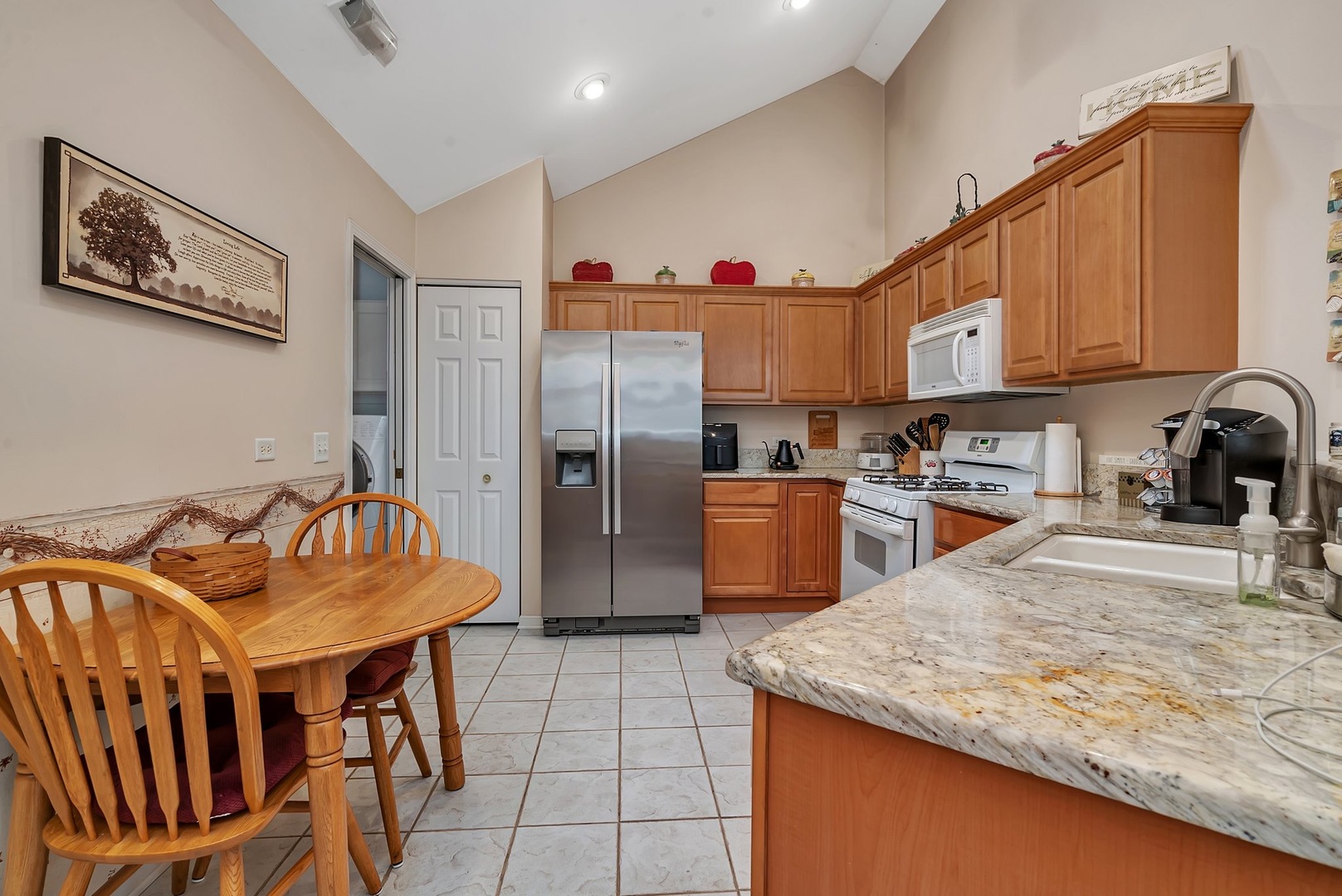 1950 Timbers Edge Circle Joliet, IL 60431 - Photo 13 of 24 a kitchen with stainless steel appliances granite countertop a sink refrigerator and cabinets