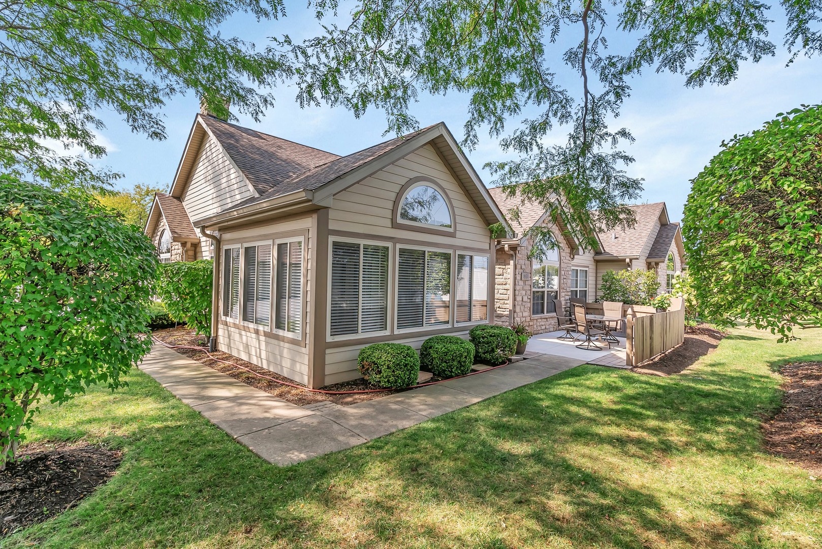 1950 Timbers Edge Circle Joliet, IL 60431 - Photo 4 of 24 a front view of a house with garden